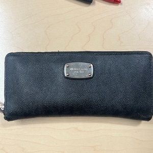 Michael Kors check book holding wallet! Black and is in great condition!